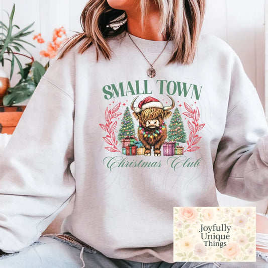 Short Sleeve T-Shirt Christmas Lights Santa Hat Highland Cow Small Town Christmas Club
