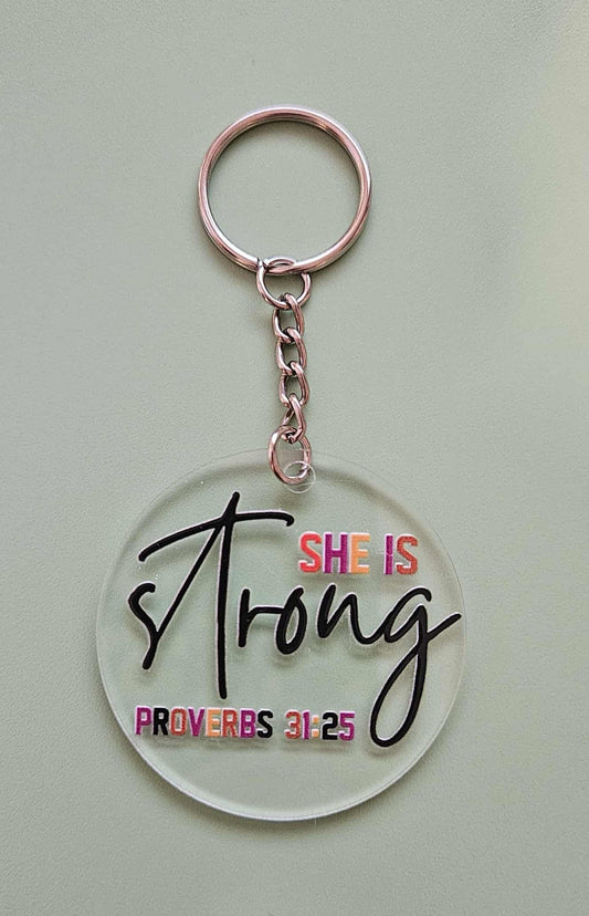 Clear Acrylic 2.5" Round Keychain With UV DTF Sticker She Is Strong Proverbs 31:25 - Joyfully Unique Things